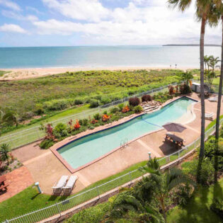an aerial view of the pool and beach at BreakFree Great Sandy Straits Hervey Bay