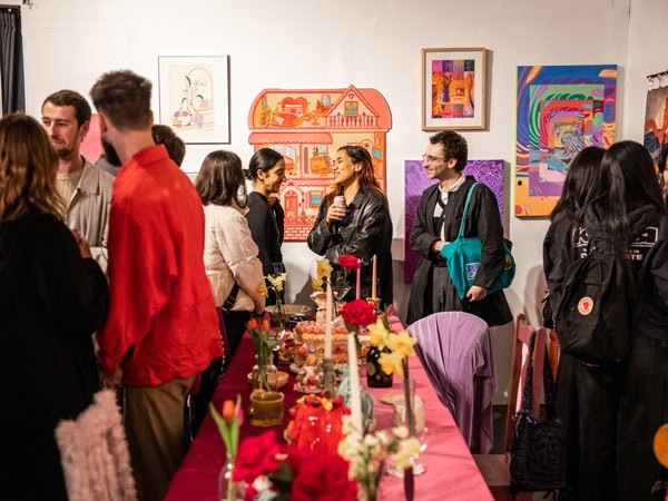 a crowd-filled art space at Honey Bones Gallery, Brunswick