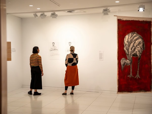 two women admiring artworks at Koorie Heritage Trust, Melbourne