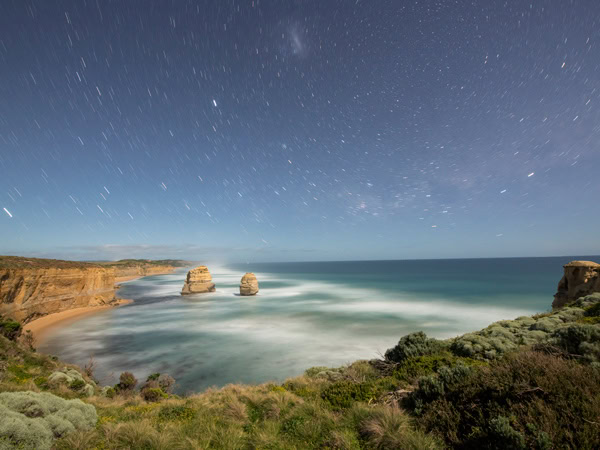 a night sky full of stars at the Twelve Apostles, Great Ocean Road