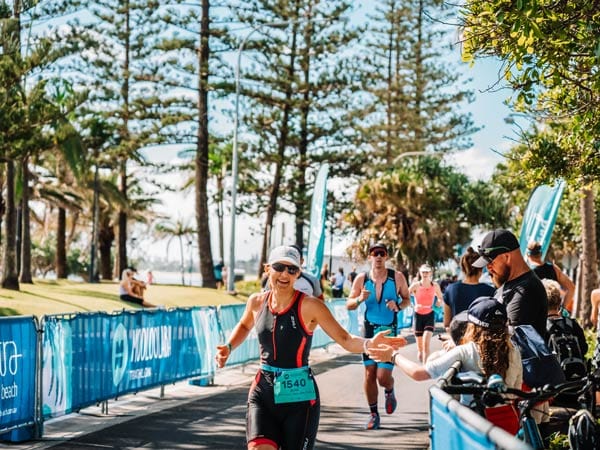 Woman running in the Mooloolaba Triathlon on the Sunshine Coast