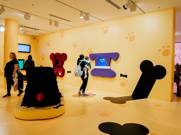 visitors admiring artworks inside NGV International, Melbourne