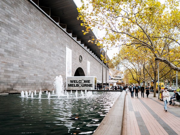 a welcome to Melbourne signage at the exterior of NGV International