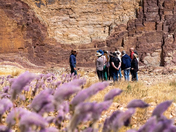 a group of travellers exploring Ochre Pits in the West MacDonnell Ranges