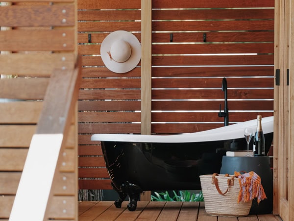 a deep-soaking tub inside a safari tent at Port Fairy Holiday Park