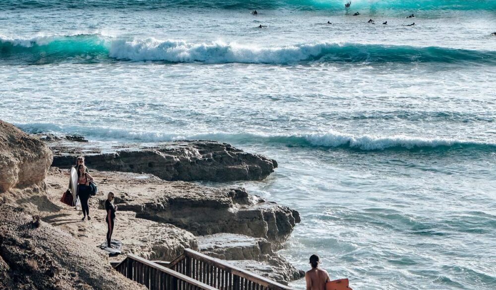 Surfers using the coastal walk at Port Noarlunga South