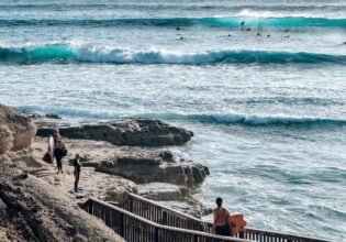 Surfers using the coastal walk at Port Noarlunga South