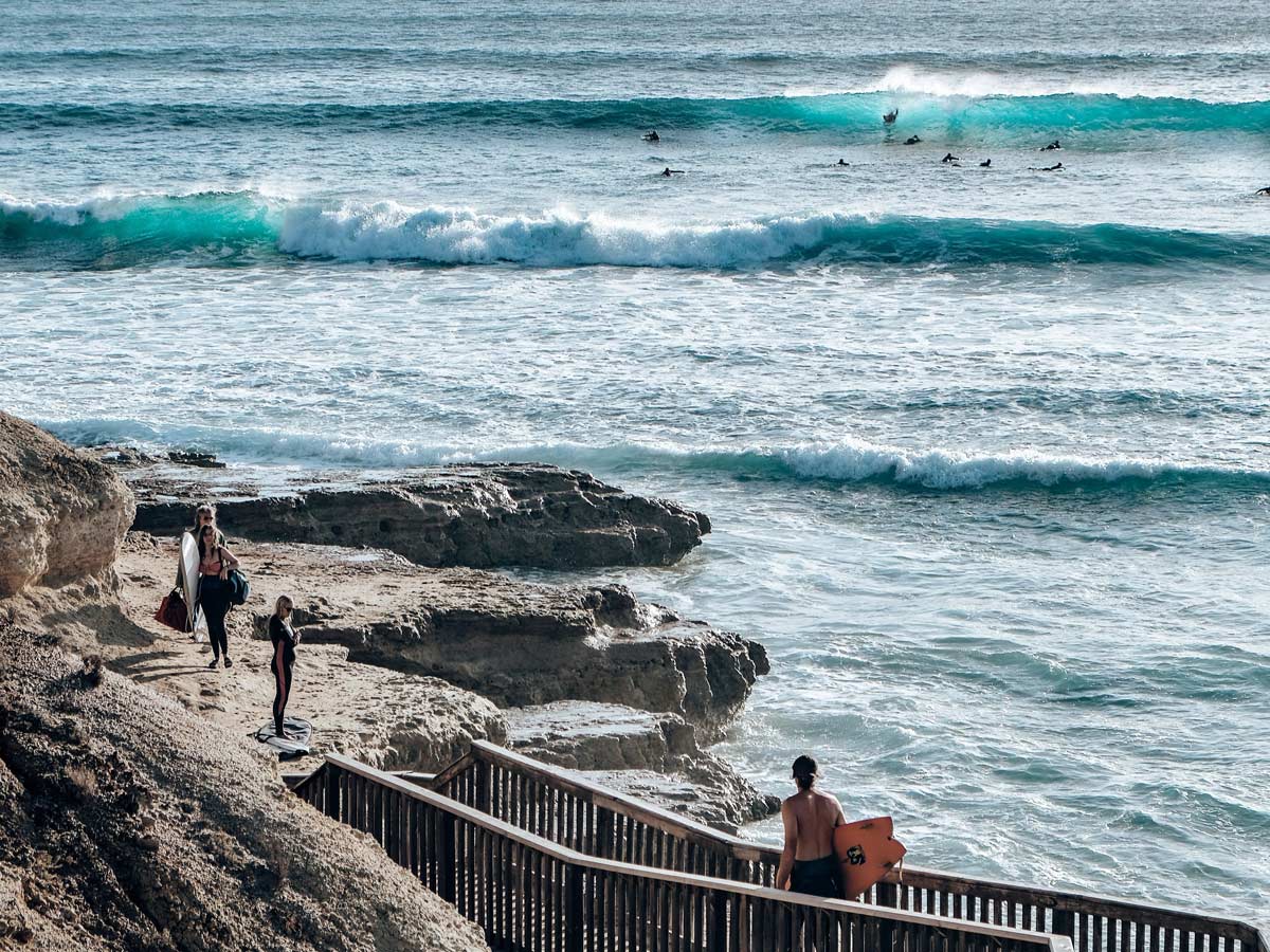 Surfers using the coastal walk at Port Noarlunga South