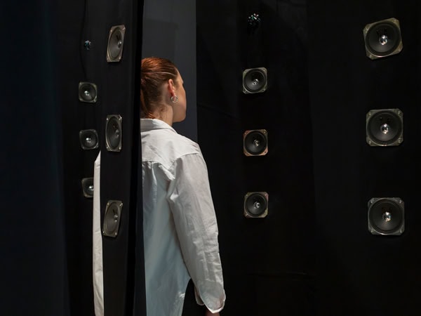 a woman viewing an exhibition of Indonesian Australian artist, Tintin Wulia at RMIT Gallery, Melbourne