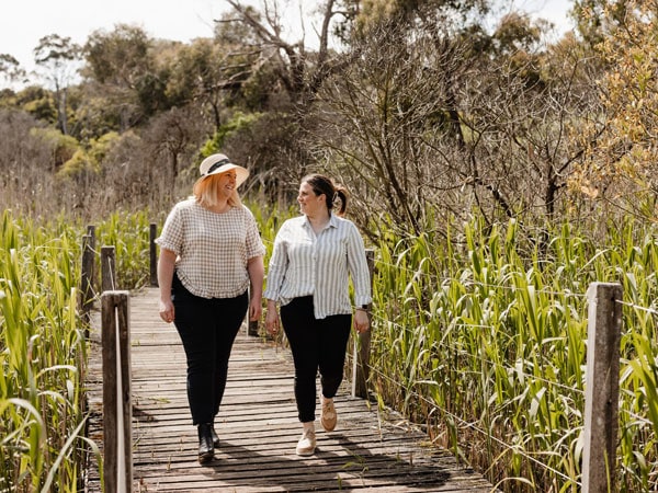 two women walking along the Tower Hill Reserve, Port Fairy