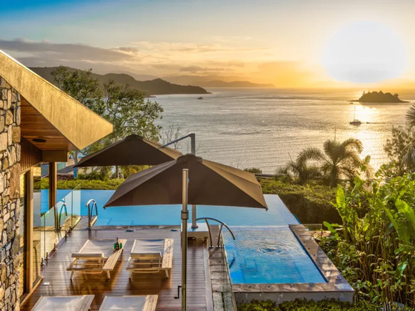 sunset views from the private infinity pool of Trisara, Hamilton Island Luxury Homes