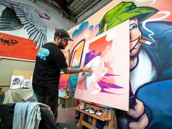 an artist painting at The Blender Studios, West Melbourne