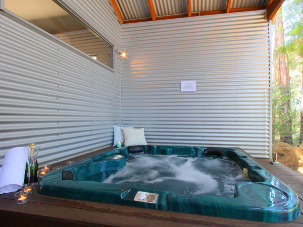 a private outdoor heated jacuzzi at Hidden Valley Eco Lodge & Day Spa, Pickering Brook