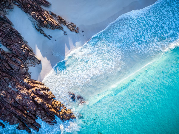 the rocky white sand shore of Injidup Beach, Yallingup