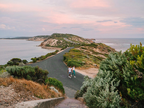 a couple walking along Point Nepean National Park