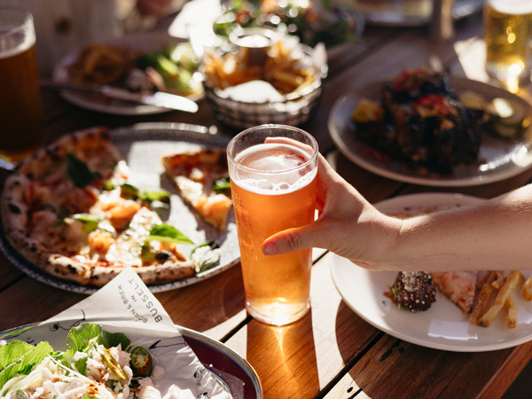 Food and beer on the table at Shelter Brewing