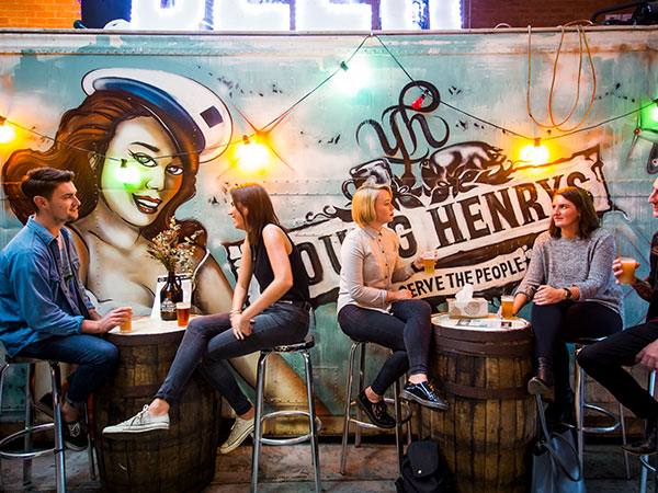 mural and patrons at Young Henrys Brewing sydney