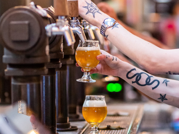 filling up glasses of beer at Stomping Ground Brewery & Beer Hall, Collingwood