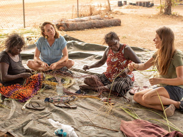 women weaving at Injalak Arts Centre, Gunbalanya