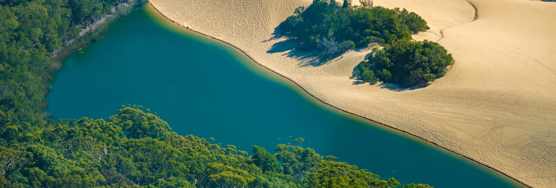 Aerial view of Hammerstone Sandblow and Lake Wabby, K'gari, a World Heritage-listed sand island