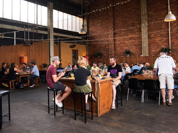 people enjoying drinks at Mountain Goat Brewery, Richmond