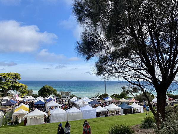 A landscape image of Mt Martha South Beach Market that includes the coastal view.