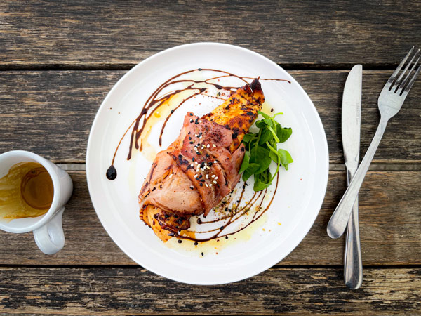 a table-top view of a breakfast plate with coffee at Pelikan Société, Hastings