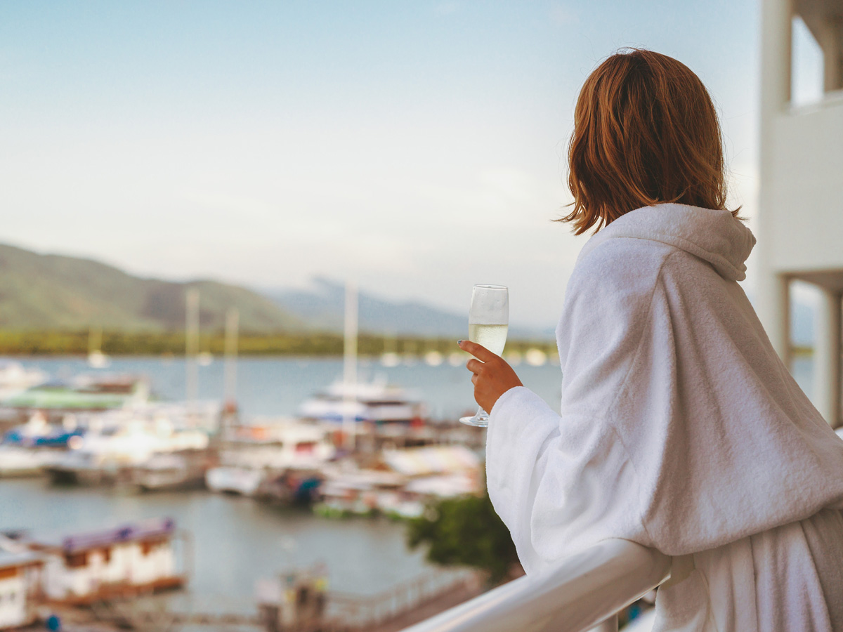 Woman celebrating with a stay at Shangri-La The Marina Cairns