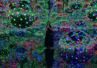 standing at the Infinity Mirror Room, Yayoi Kusama at the National Gallery of Victoria