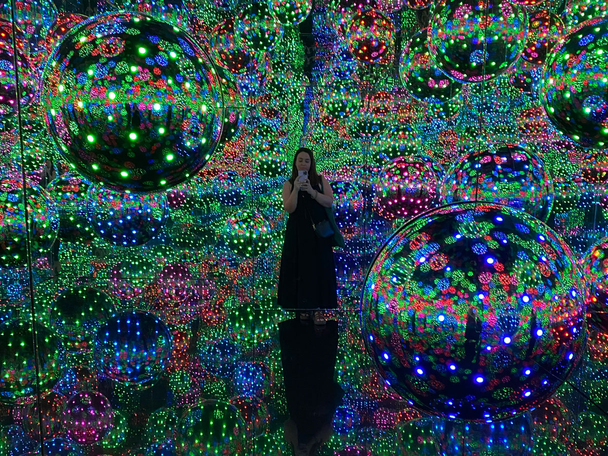 standing at the Infinity Mirror Room, Yayoi Kusama at the National Gallery of Victoria