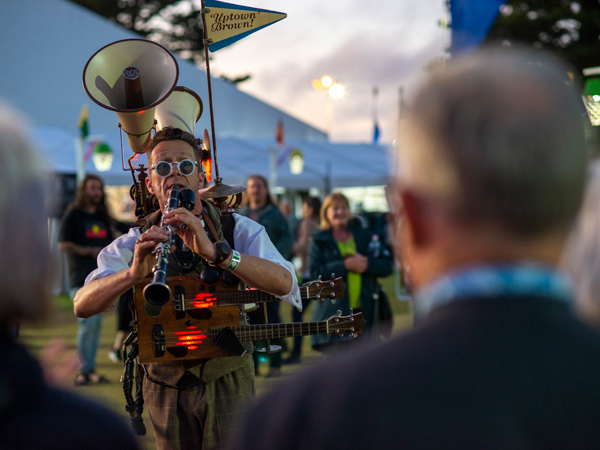 a musician playing his instruments at the 2023 Port Fairy FolkFestival