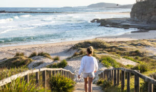 a woman walking to the shore, Pretty Beach, Shoalhaven