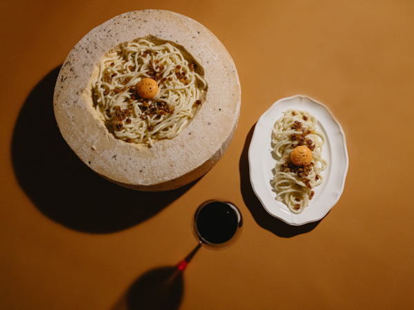 Parmesan pasta wheel and pasta at Rovollo, Sydney