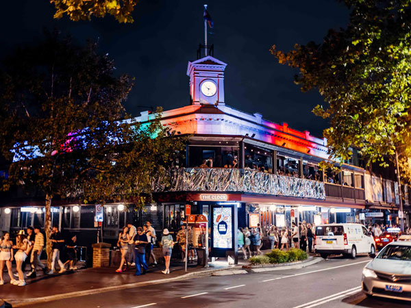 the exterior of The Clock pub at night