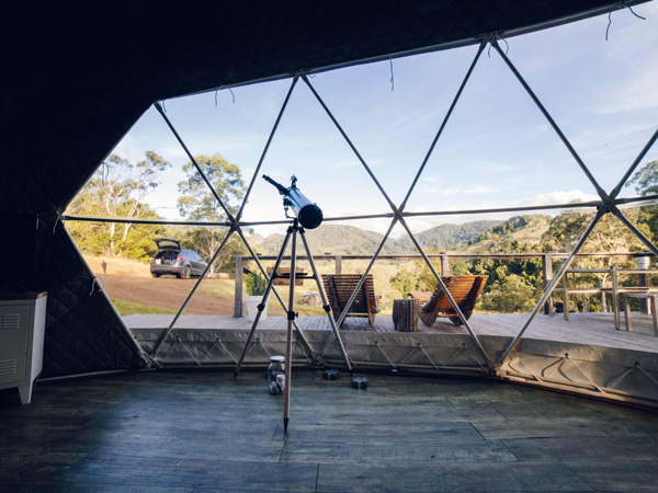 a luxury glamping dome with a telescope at Toms Creek Nature Domes, Port Macquarie