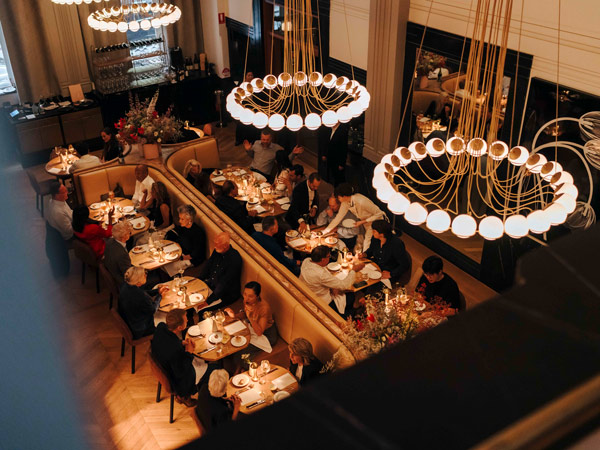 ornate chandeliers hanging from the ceiling of The Charles Brasserie & Bar, French restaurant Sydney