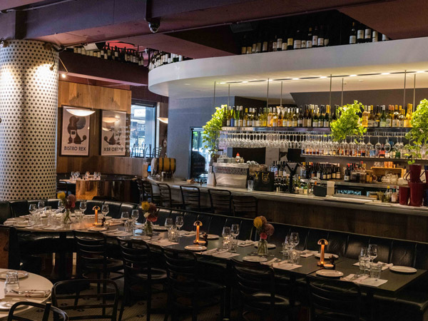 the dimly lit interior of Bistro Rex, French restaurant Sydney