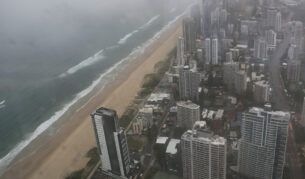 View south along the Gold Coast, from Broadbeach cityscape through window of high observation point on stormy, overcast afternoon