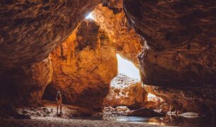 woman standing inside Dimalurru (Tunnel Creek) the kimberleys western australia