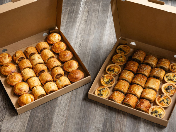 two boxes of baked goods from Bourke St Bakery