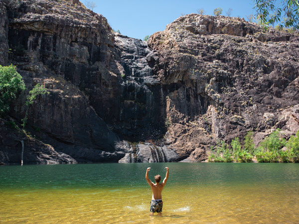 guy splashing at Gunlom Falls, Kakadu National Park