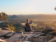 woman enjoying the view after hiking through Noosa National Park, noosa in winter