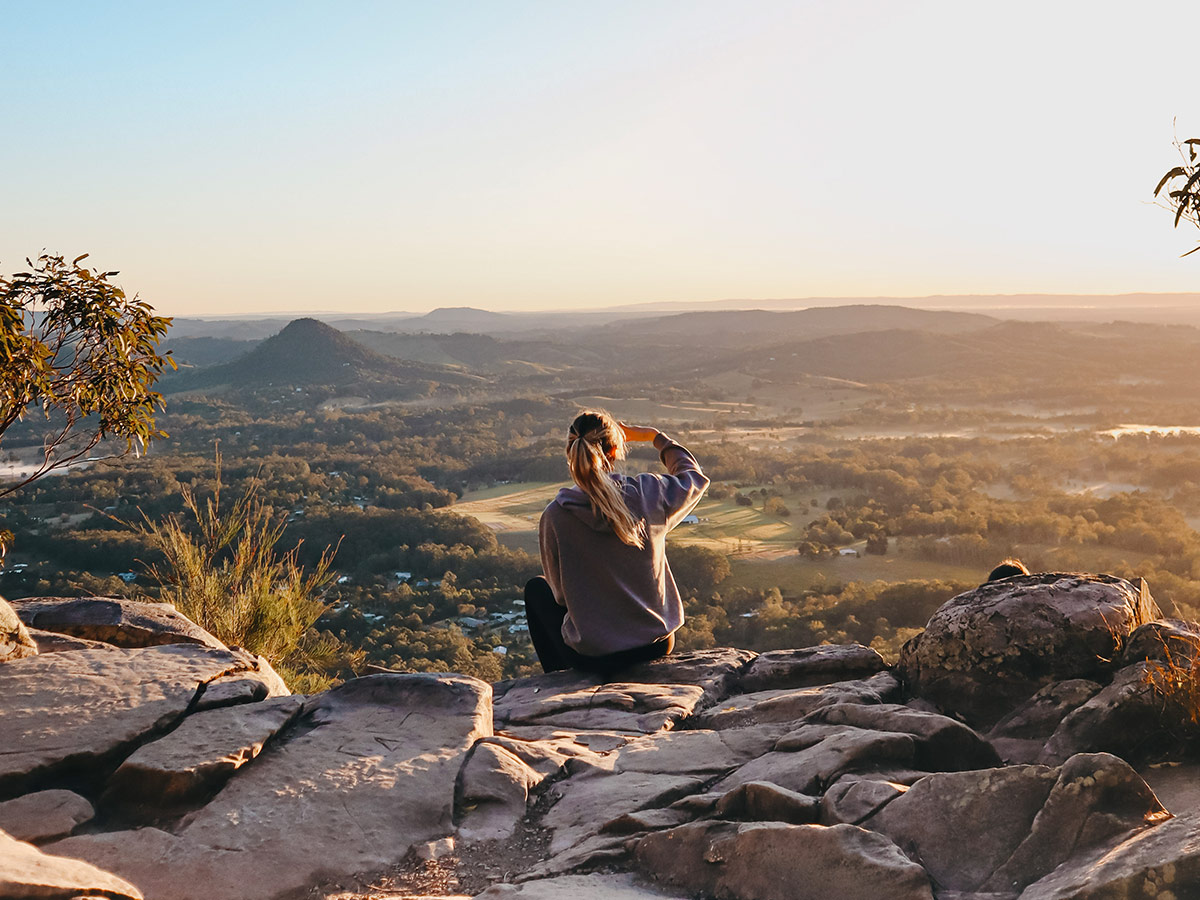 woman enjoying the view after hiking through Noosa National Park, noosa in winter