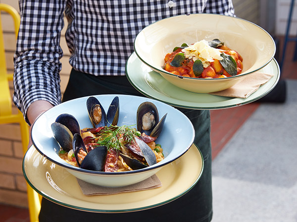waiter holding mussels at Portarlington Grand Hotel