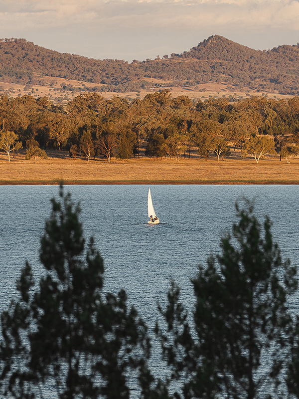 A person kayaking through serene waters.