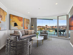 the living room interior of a Deluxe Harbour View Suite at Pullman Quay Grand Sydney Harbour
