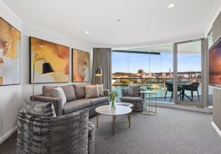 the living room interior of a Deluxe Harbour View Suite at Pullman Quay Grand Sydney Harbour