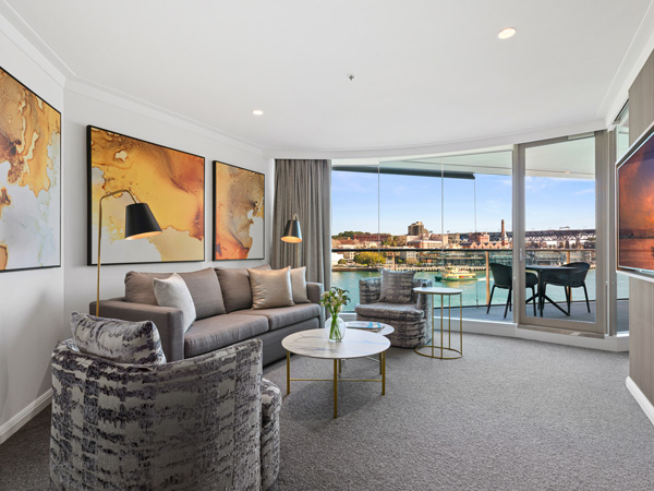 the living room interior of a Deluxe Harbour View Suite at Pullman Quay Grand Sydney Harbour