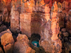 A couple stands over a waterhole in the Dampier Peninsula WA