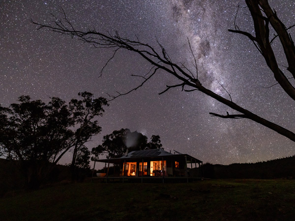 Kestrel Nest EcoHut at night with Milky Way above